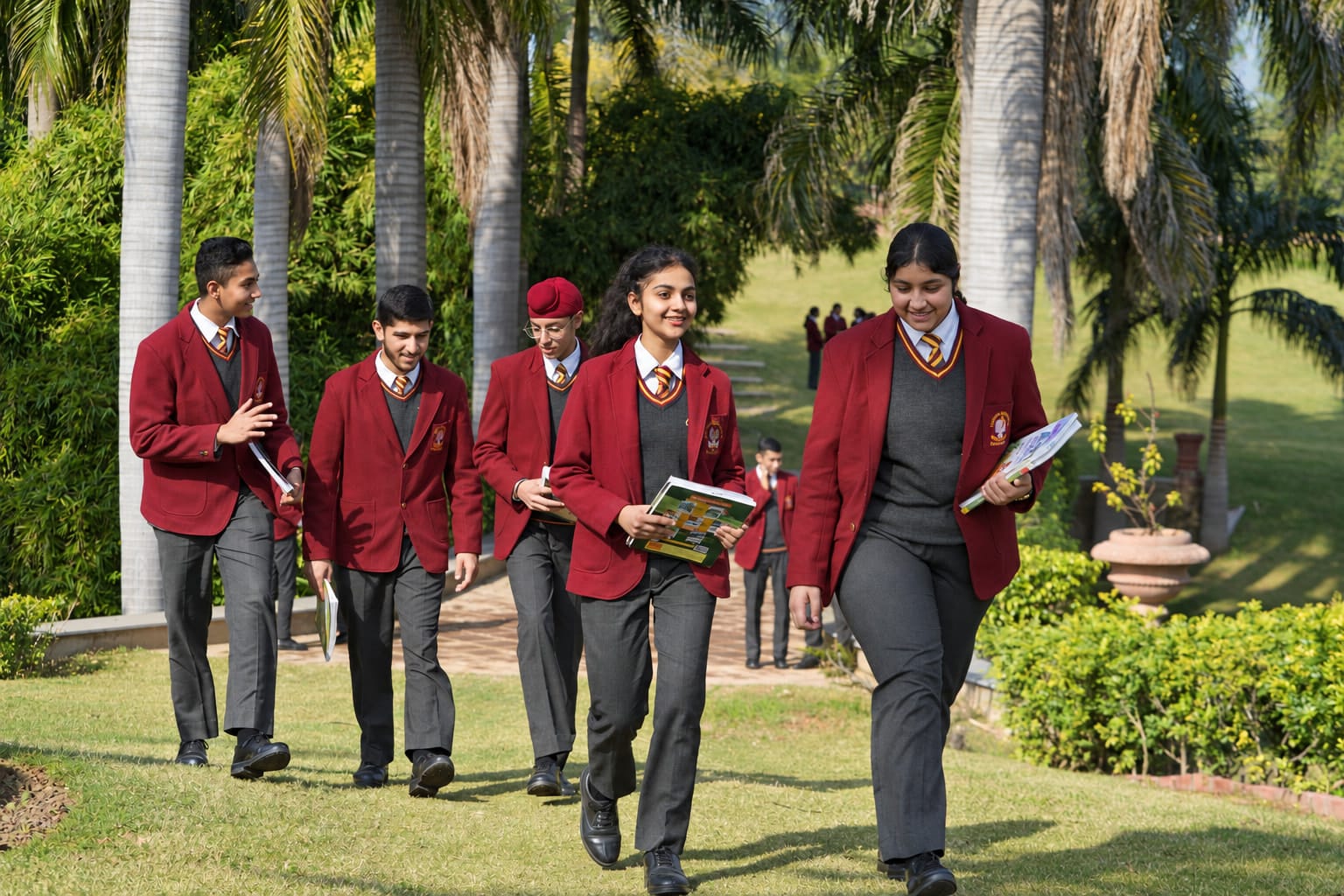 Students walking together across the campus lawn